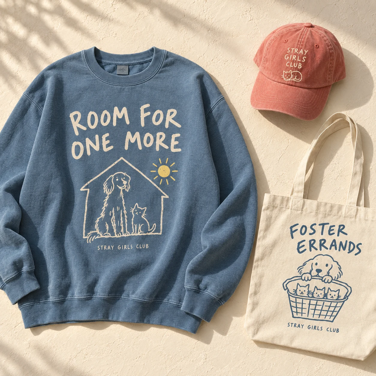 Our first collection: a blue Room for One More sweatshirt, coral club cap, and Foster Errands tote.